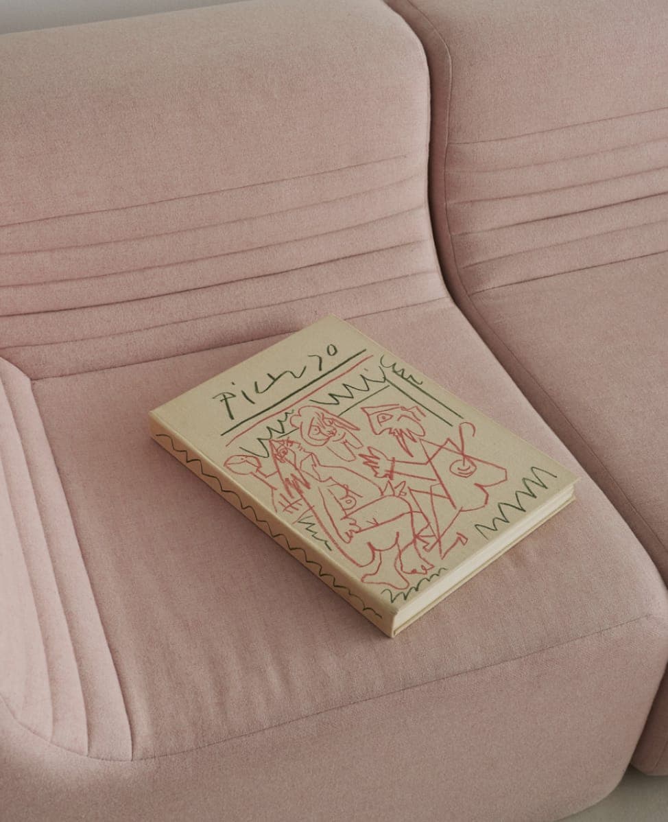 A Dreamhouse publication on a pink couch